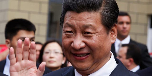 Chinese President Xi Jinping waves during a visit to a housing development in Caracas, Venezuela 2014. The Chinese president has visited Latin America more times over the past decade than former Presidents Obama, Trump and current President Biden combined. 