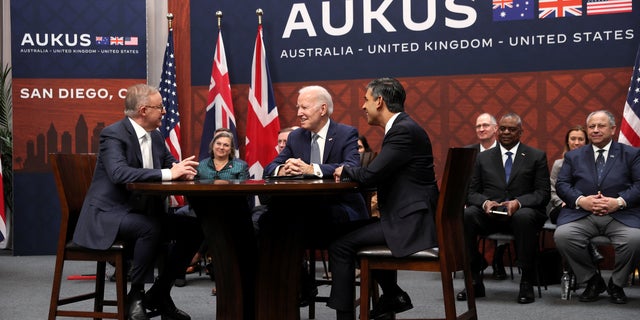 President Biden, center, Australian Prime Minister Anthony Albanese, left, and British Prime Minister Rishi Sunak gather for a trilateral meeting, at Naval Base Point Loma in San Diego March 13, 2023.