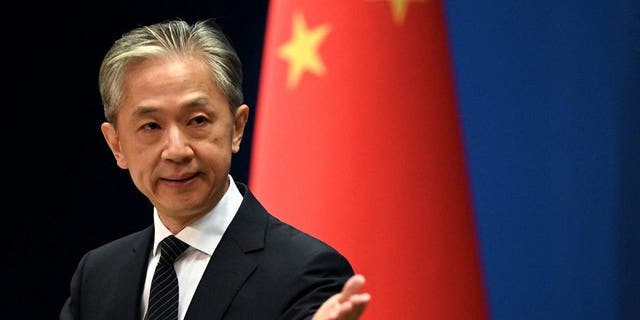 Chinese Foreign Ministry spokesman Wang Wenbin gestures during a press conference at the Ministry of Foreign Affairs in Beijing on Aug. 8, 2022.