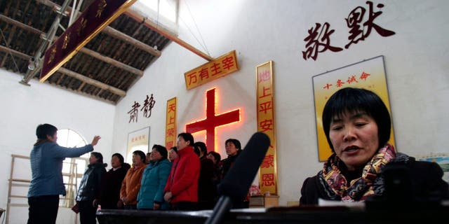 A choir sings during a rehearsal for performance to mark the Chinese New Year at a countryside church in Luoyang of Henan Province, China.