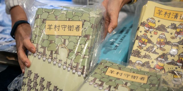 Children's books are pictured during a press conference after five people were arrested under suspicion of conspiring to publish seditious material at the Hong Kong Police Headquarters on July 22, 2021, in Hong Kong, China.