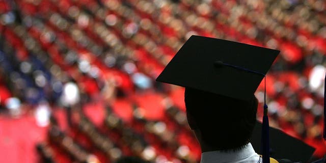 Students graduate during a ceremony held for 3,768 master and 898 doctorates being given out at the Tsinghua University on July 18, 2007 in Beijing. China faces a major challenge in meeting its goal of creating 9 million jobs this year, according to Tian Chengping, Minister of Labour and Social Security. Approximately 5 million college graduates, the largest number in history, will enter the job market this year, in addition to surplus rural labourers swarming into cities for work.