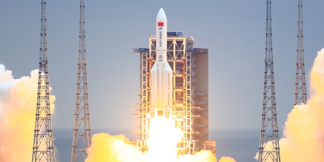WENCHANG, CHINA - APRIL 29: A Long March-5B Y2 rocket carrying the core module of China's space station, Tianhe, blasts off from the Wenchang Spacecraft Launch Site on April 29, 2021, in Wenchang, Hainan Province of China. 