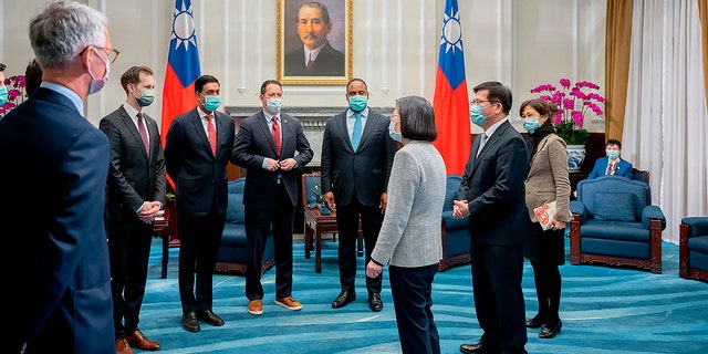 In this photo released by the Taiwan Presidential Office, Taiwan's President Tsai Ing-wen, center, meet with a U.S. delegation led by California Rep. Ro Khanna, third from left during a meeting at the Presidential Office in Taipei, Taiwan on Tuesday, Feb. 21, 2023.