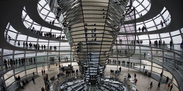 Visitors stand inside the cupola of the German Bundestag (lower house of parliament) in Berlin.