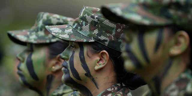 Female voluntary recruits attend a three-month training program in Bogotá, Colombia, on March 6, 2023. The country's army is once again allowing women to join its ranks through voluntary military service.