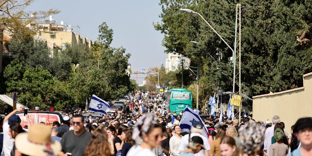 Over a thousand people mourn Elan Ganeles, a dual U.S.-Israeli citizen killed in a shooting attack while he was driving near the West Bank city of Jericho by terrorists, during his funeral, outside the cemetery, in Raanana, Israel, March 1, 2023. REUTERS/Nir Elias