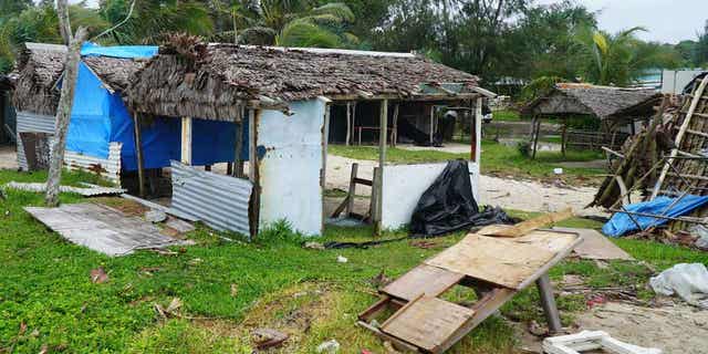 Damaged buildings are pictured near Vanuatu's capital on April 7, 2020, after Tropical Cyclone Harold hit the island. Another cyclone hit Vanuatu on March 1, 2023, causing trees to be knocked over and flooding.