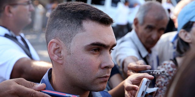 Cuban shipwreck survivor Elian Gonzalez speaks to the press as he arrives to pay tribute to Cuba's late President Fidel Castro at the Jose Marti Memorial in Revolution Square in Havana Nov. 29, 2016. He was recently elected as a legislator in Cuba.          
