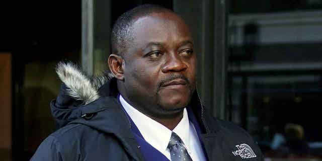 Former Haitian Mayor Jean Morose Viliena departs federal court on March 20, 2023, in Boston. Viliena has been criminally charged with lying on his application to become a United States citizen.
