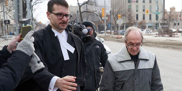 Retired priest Arthur Masse, 93, leaves the Law Courts in Winnipeg on March 30, 2023, after a judge acquitted him of forcing himself on a residential school student more than 50 years ago.