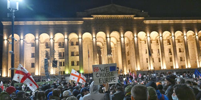 Georgian opposition supporters call for the government to drop a controversial "foreign agent" bill, which they say is reminiscent of Russian legislation used to silence critics, during a demonstration in Tbilisi on March 9, 2023. (Vano Shlamov / AFP via Getty Images)