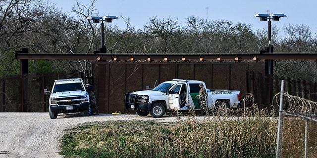 US border Police patrol on the bank of the Rio Grande near the Gateway International Bridge, between the cities of Brownsville, Texas, and Matamoros, Tamaulipas, Mexico on March 16, 2021, in Brownsville, Texas.