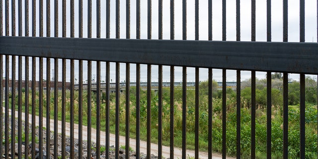 The Gateway International Bridge between Brownsville, Texas and Matamoros, Mexico, as seen through the border wall. Viewed from Texas side of the wall. 