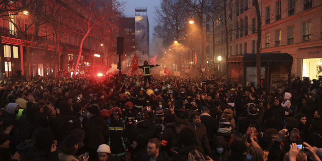 Protesters march during a rally in Paris, France, on Thursday night.