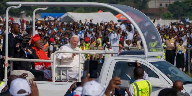 Pope Francis arrives to celebrate Holy Mass, in Kinshasa, Congo, Feb. 1, 2023.