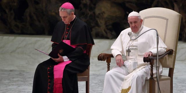 Pope Francis and German Archbishop Georg Gaenswein, prefect of the Pontifical House, during the weekly general audience in the Paul VI Hall, Vatican City, Jan. 15, 2023.