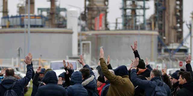 Oil workers vote to renew the strike at an oil refinery in France on March 10, 2023, in Paris. French President Emmanuel Macron insisted on the need for pension reform in the country to make the system more sustainable for the future.     