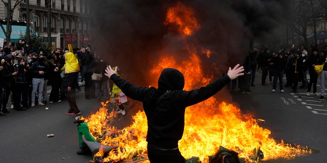 A man gestures during a demonstration Tuesday, March 28, 2023, in Paris. 