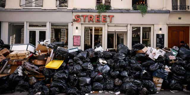 Uncollected garbage is piled up on a street in Paris, France, on March 15, 2023, as sanitation workers continue to strike.