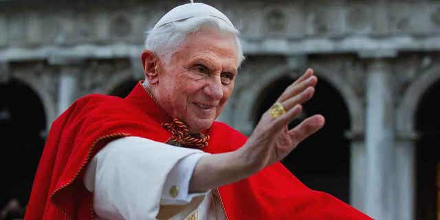 Pope Benedict XVI greets the crowd gathered in St Mark's Square on May 7, 2011, in Venice, Italy. German authorities investigated Pope Benedict XVI on suspicion of being an accessory to abuse.