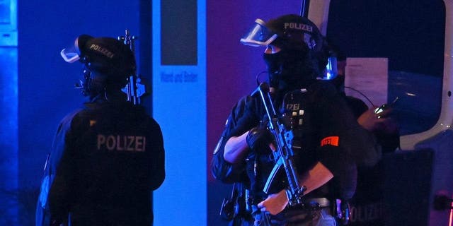 Armed police officers near the scene of a shooting in Hamburg, Germany on Thursday, March 9, 2023 after one or more people opened fire in a church. The Hamburg city government said the shooting took place in the Gross Borstel district.