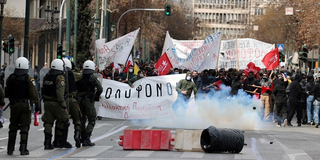 Riot police operated against demonstrators during clashes in Athens, Greece, on Sunday. Thousands of protesters take part in rallies around the country for fifth day over the conditions that led the deaths of dozens of people last week in Greece's worst recorded rail accident.