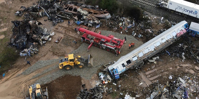 The wreckage of the trains lie next to the rail lines, after Tuesday's rail crash, the country's deadliest on record, in Tempe, about 235 miles north of Athens, near Larissa city, Greece, on Friday.