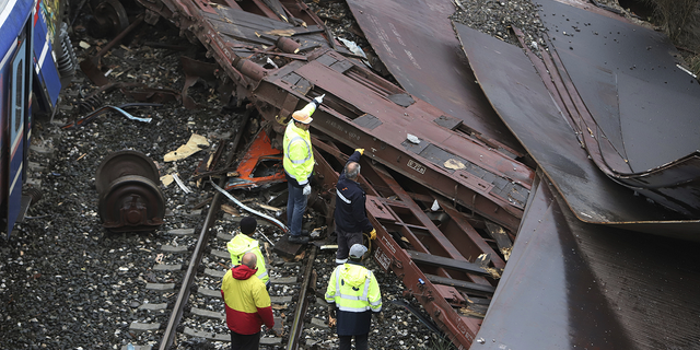 First responders are seen Thursday on the stretch of train tracks in northern Greece where the collision unfolded.