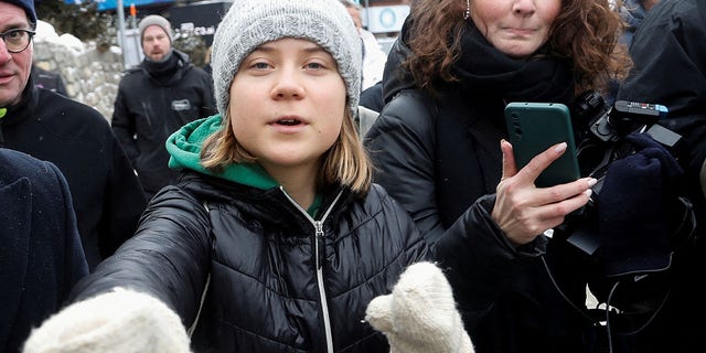 FILE: Climate activist Greta Thunberg gestures as she walks outside during the World Economic Forum in Davos (WEF) in Davos, Switzerland January 19, 2023.