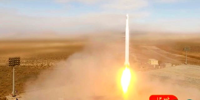 This image taken from video footage aired by Iranian state television on March 8, 2022, shows the launch of a rocket by Iran's Revolutionary Guard carrying a Noor-2 satellite in northeastern Shahroud Desert, Iran.