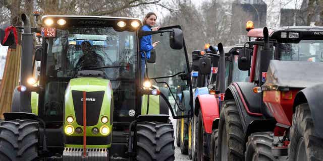 Tractors driven by angry farmers block traffic on a road in the center of Brussels, during a demonstration on March 3, 2023. 