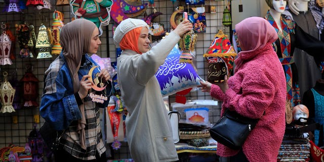 Ramadan shoppers gather in Sidon, Lebanon. The Middle Eastern nation is experiencing civil unrest as its currency continues plummeting in value.