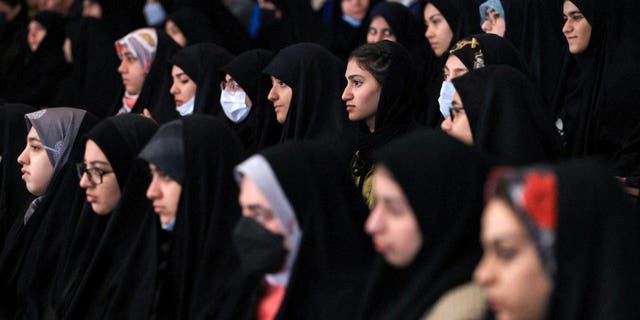 Female students attend a ceremony of National Student Day at Tehran University in Tehran, Iran.