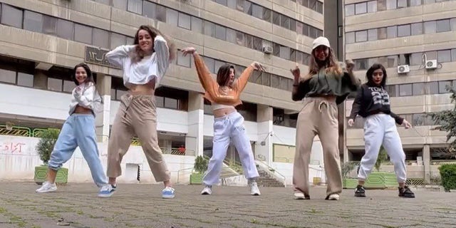 A still image from a social media video depicting five Iranian teen girls dancing to a Selena Gomez song. 