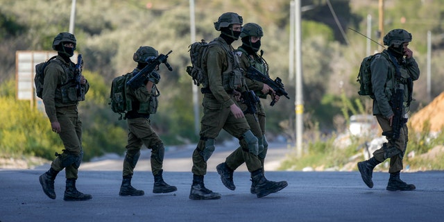 Israeli forces fatally shot three Palestinian gunmen who opened fire on troops near the West Bank city of Nablus. 