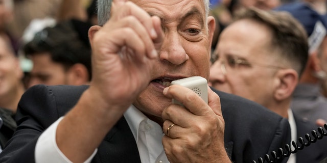 Prime Minister Benjamin Netanyahu speaks to his supporters during a campaign event during last year's election.