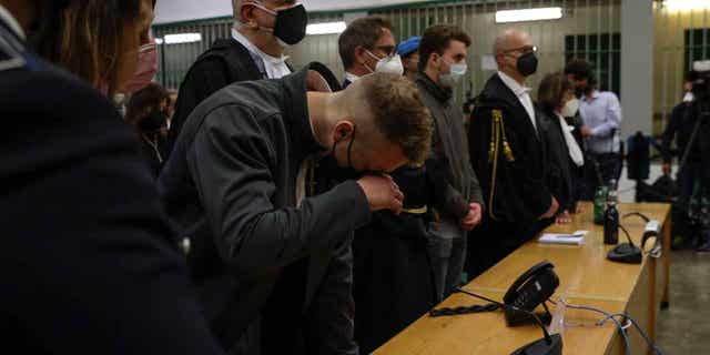 Finnegan Lee Elder wipes his eye as he and his co-defendant listen as the verdict is read, in the trial for the homicide of an Italian police officer near their hotel in Rome in 2019, on May 5, 2021. Italy’s highest court on March 15, 2023, was hearing the final appeal of two U.S. citizens.