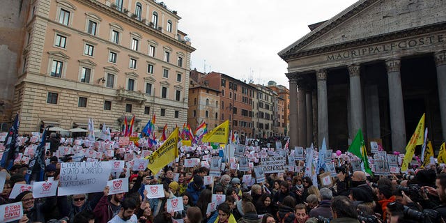 Activists demonstrate in favor of rights for gay couples in Rome on Jan. 23, 2016. The Italian government has limited parental rights of same-sex couples in a move denounced as homophobic by gay rights activists.