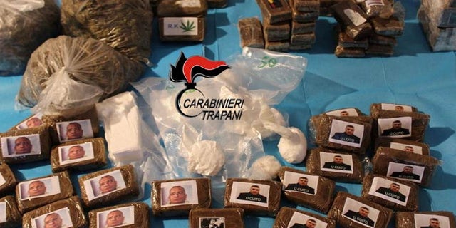 FILE: Drug packages decorated with pictures of Sicilian Mafia bosses Salvatore Riina and Matteo Messina Denaro are displayed in Marsala, Italy, March 21, 2023.