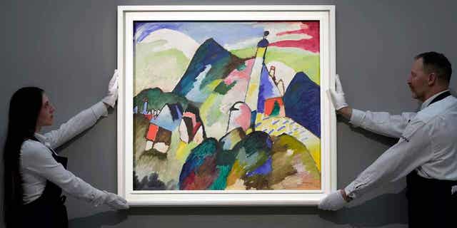 The painting "Murnau with Church II" by Russian artist Wassily Kandinsky is on display during a media preview of Sotheby's auction, in London on Feb. 22, 2023. The piece sold for $44.9 million at the auction on March 1, 2023. 