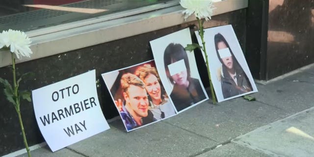 A photo showing Otto Warmbier and North Korean victims of the Kim regime outside the North Korean U.N. mission in New York.