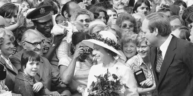 People gather to greet Britain's Queen Elizabeth II as she walked along the famous Kurfuerstendamm Boulevard in West Berlin, Germany, on May 24, 1978. A report claimed that the late monarch asked for two expensive horses when she visited the country in 1978.