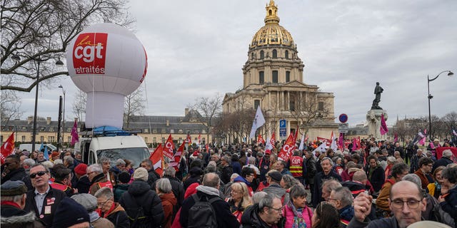 Centrist French President Emmanuel Macron's government has survived two votes of no confidence as national unrest continues over his plan to raise the retirement age from 62 to 64.