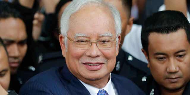Former Malaysian Prime Minister Najib Razak gets into a car after his court appearance in Kuala Lumpur, Malaysia, on April 3, 2019. Malaysia's top court refused on March 31, 2023, to review its decision to uphold Razak's graft conviction.