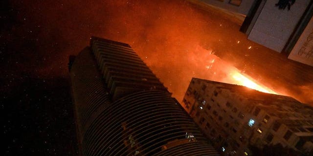 A fire breaks out in an office building in Tsim Sha Tsui, in Hong Kong on early March 3, 2023. 