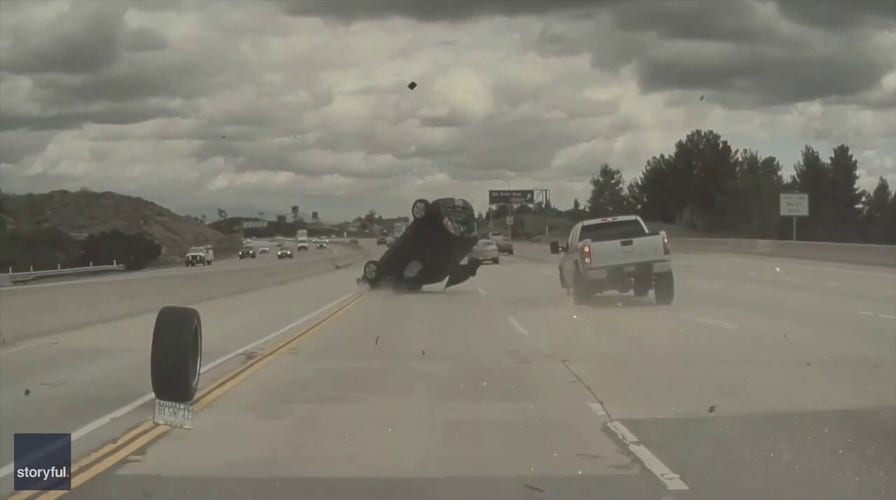 Car flips on Los Angeles freeway after tire pops off pickup truck, video shows