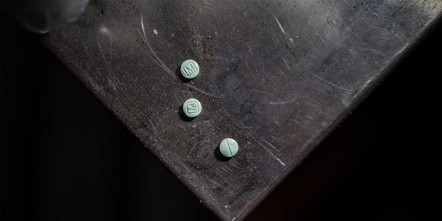 Fentanyl pills sit on a surface in Tijuana, Mexico, on July 28, 2022. Mexican police found 1.8 million fentanyl pills in a border city of Tijuana this week.