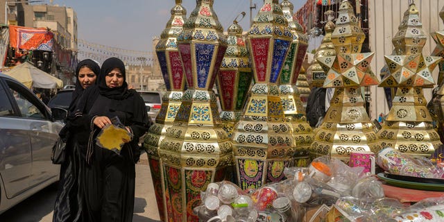 People buy traditional lanterns in Sayyeda Zeinab market ahead of the upcoming Muslim fasting month of Ramadan, in Cairo, Egypt, on March 21, 2023.