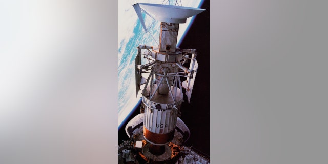 The Magellan probe heads out of the cargo bay of the shuttle Atlantis, on its way to radar-map Venus. 